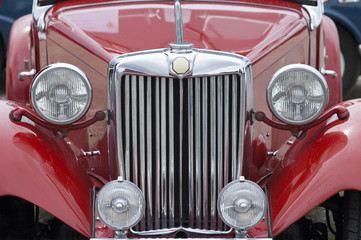 Front of old red car, closeup