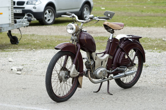 Vintage old retro brown motorbike staying on the street