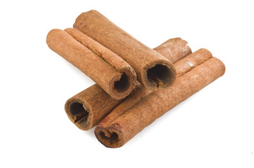 cinnamon sticks stacked on the white background
