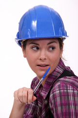 A portrait of a female construction worker.