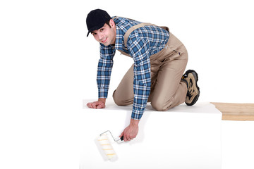 Painter painting a rectangular structure