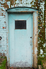Fototapeta na wymiar Blue Door w Blue Brick Wall