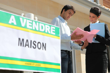Agent discussing details with a property vendor