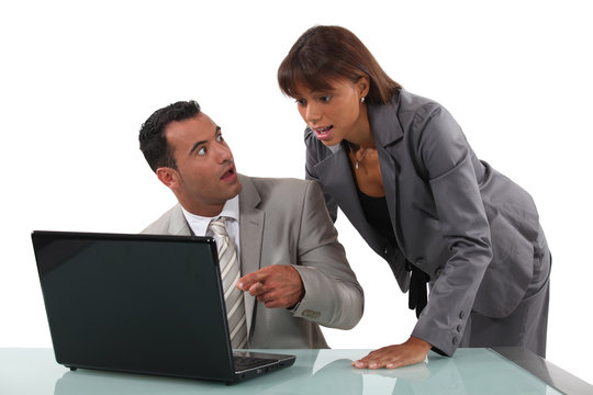 businessteam surprised of what they see on the laptop