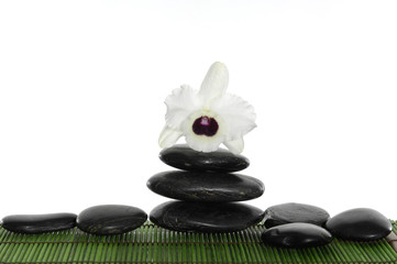 Zen Stones with white orchid on green mat