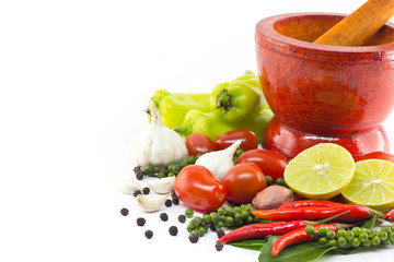Fresh herbs and spices with wooden mortar