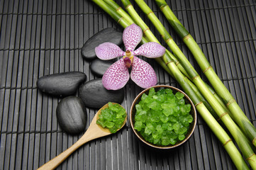 pink orchid, with zen stone and bamboo grove on mat
