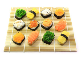 Delicious sushi rolls on sushi mat