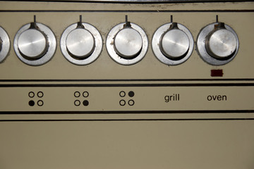 old rusty home cooker dials