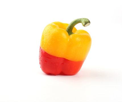 two paprika pepper slice combinated isolated on white
