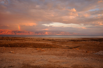 Sunset with rainbow at the dead sea