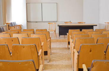 Empty conference room with chairs, blackboard