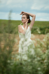 Fototapeta na wymiar Beautiful lady in wheat field 