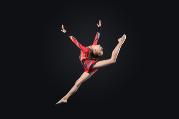 Fototapeta premium Young woman in gymnast suit posing