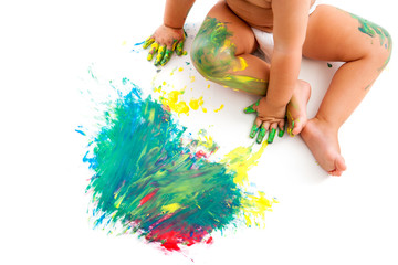 Baby sitting neat to painted mosaic.