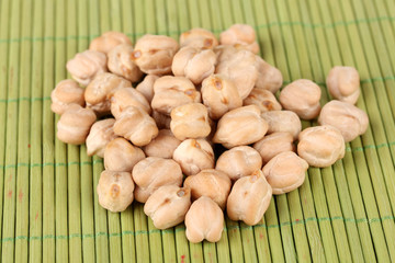 White chickpeas on color background