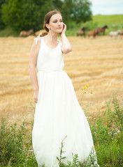Fototapeta na wymiar Beautiful lady in wheat field 