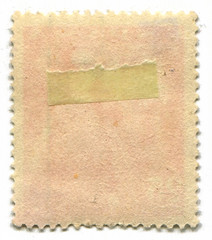 The reverse side of a postage stamp.