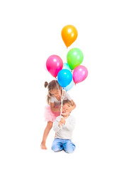 boy and girl are playing with balloons