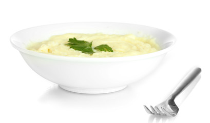 Mashed potato with parsley in the plate isolated on white