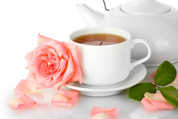 teapot and cup of tea with rose isolated on white