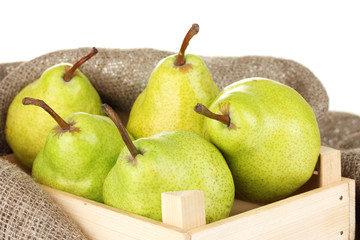 Ripe pears in wooden box close-up