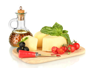 sliced mozzarella cheese with vegetables isolated on white