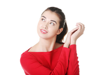 Portrait of a happy young woman looking up