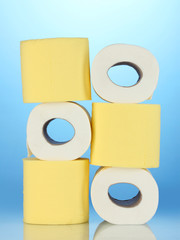 rolls of toilet paper on blue background