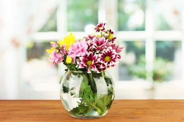 colorful bouquet of chrysanthemums in a glass vase