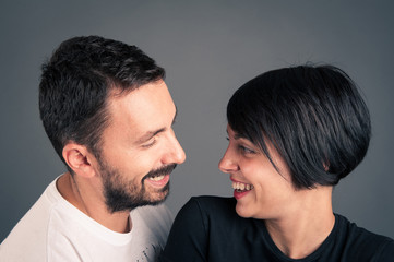 Couple having fun together. Studio portrait.