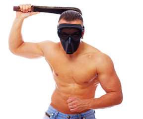 Portrait of killer with machete posing in studio