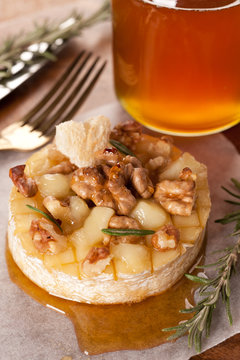 Baked cheese with honey, rosemary and walnuts