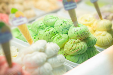 Variety of yummy ice creams under shopping window
