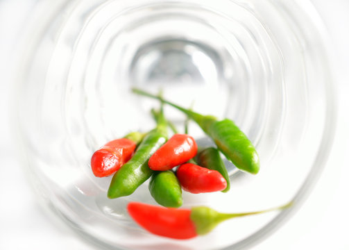 Chili in glass, isolated on white