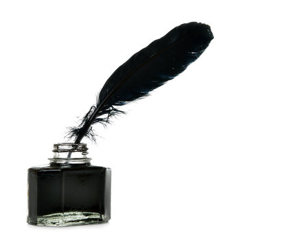 Feather and ink bottle isolated