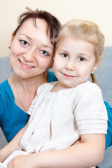 Portrait of mother with small daughter together