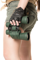 The field-glass in a female hand