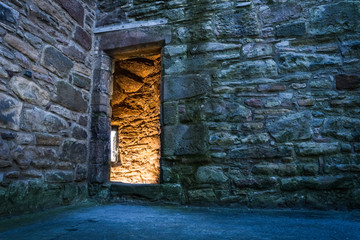Lighted dorway to the medieval castle
