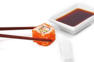Sushi with chopsticks isolated over white background