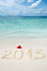 Numbers 2013 on tropical beach sand