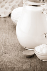 milk in glass and bottle on wooden background