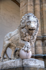 Sculpture of Lion with ball at Loggia of Lanzi. Florence, Italy