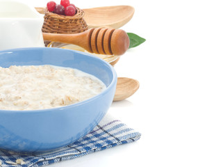 oatmeal in bowl isolated on white
