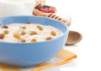 oatmeal in bowl isolated on white
