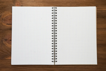 checked notepad  on wood