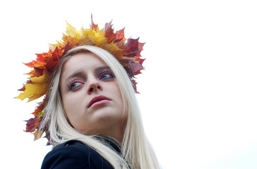 Portrait of a young lady with autumn Leaves