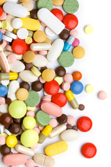Fototapeta na wymiar Kolorowe pigułki, tabletki i kapsułki