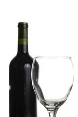 Glass and wine-bottle isolated on white