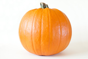 Fresh orange pumpkin isolated on white background